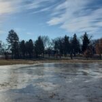 An outdoor ice skating rink melting.