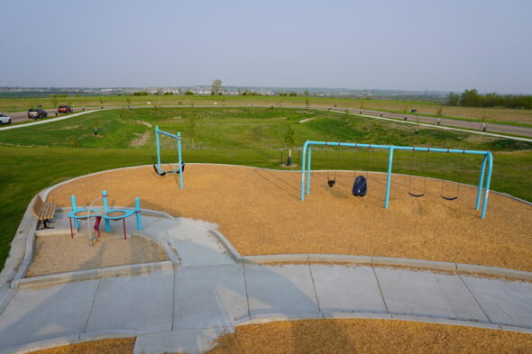 Photo of playground swings and sand table