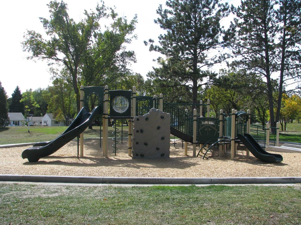 green and tan playground in Lions Park
