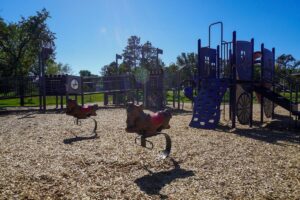 dark blue playground with rocking horses