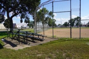 bleachers outside the fence surrounding the softball field at 16th St. Park