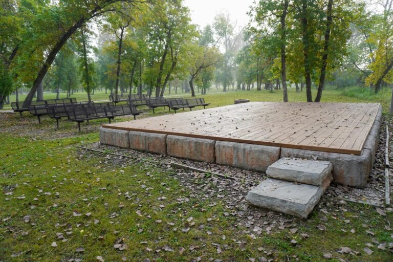 amphitheater stage and benches in a park in the fall