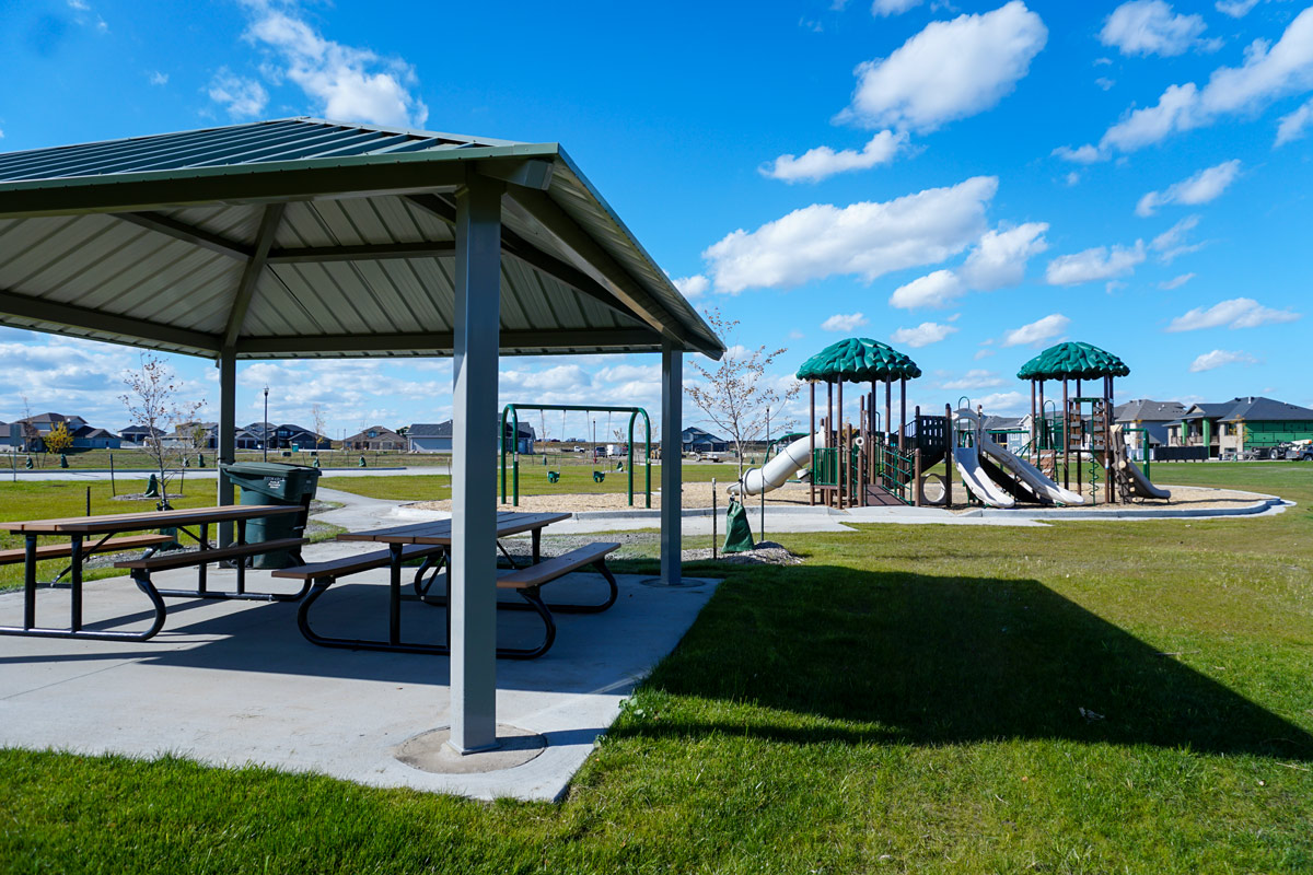 Heritage Park shelter with playground in the background