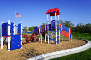 red, white, and blue playground at Heroes Park