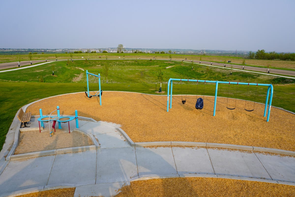 light blue playground at Promontory Point Park (swing sets and sand table)