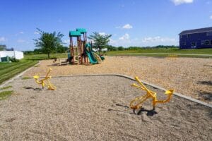 sand diggers with playground in background at Southland Park