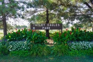 park entrance sign surrounded by plants at Tatley-Eagles Park