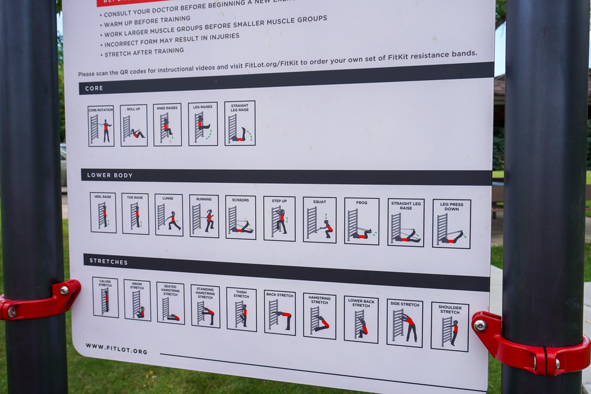 close up of the sign with different exercises on it at the Jaycee Centennial Park AARP FitLot