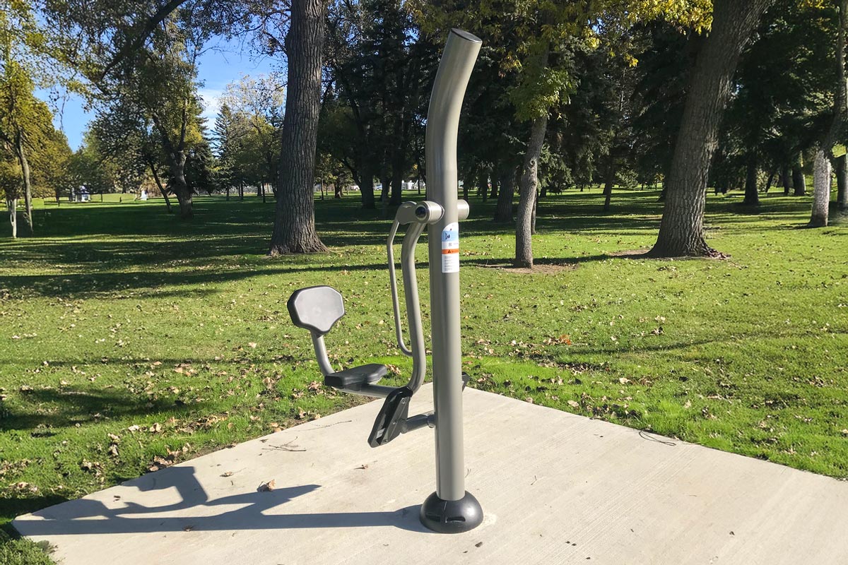 leg press fitness equipment, along a fitness trail in a park