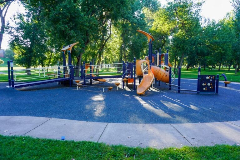 yellow, blue, and white playground near shelter 4