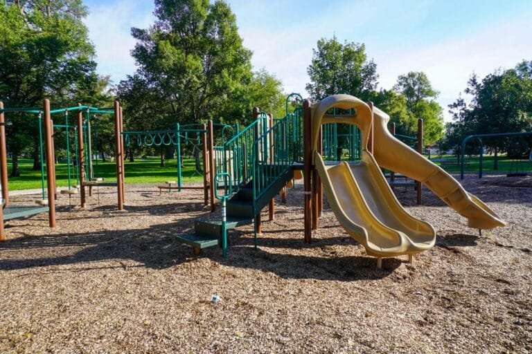 green and tan playground near shelter 8 at Sertoma Park