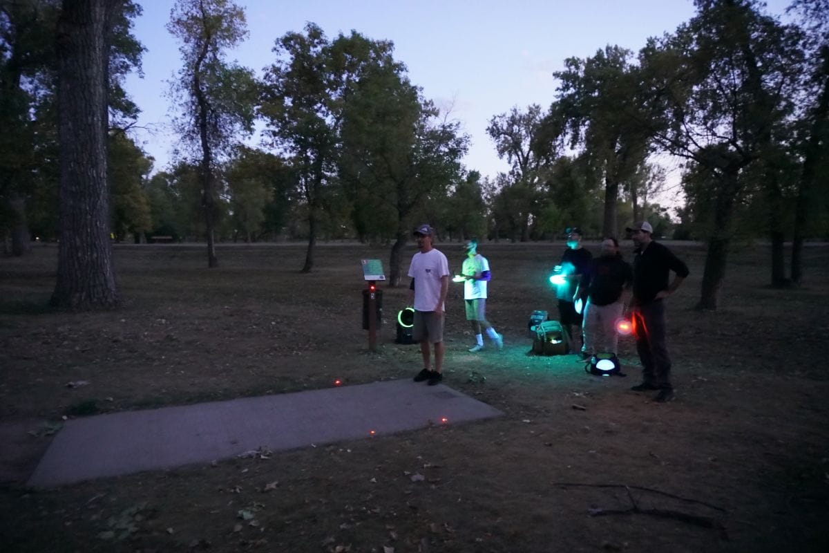 disc golfers prepare to throw their glow-in-the-dark discs during Disc in the Dark at General Sibley Park.