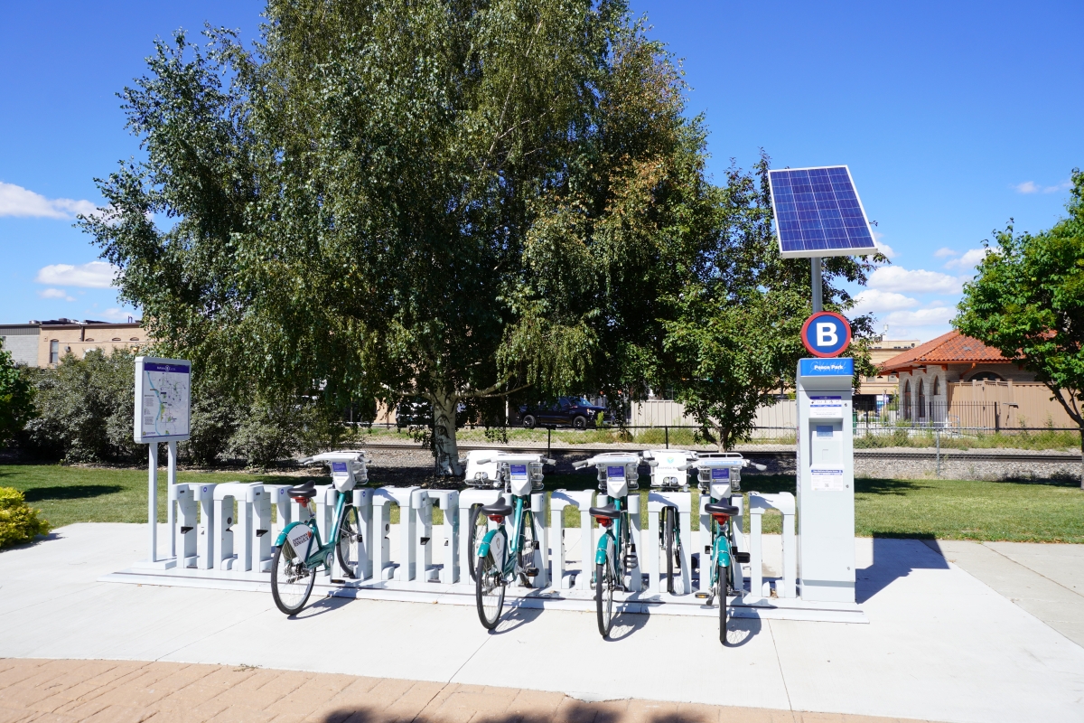 BCycle bicycles parked in a bike share station in a park