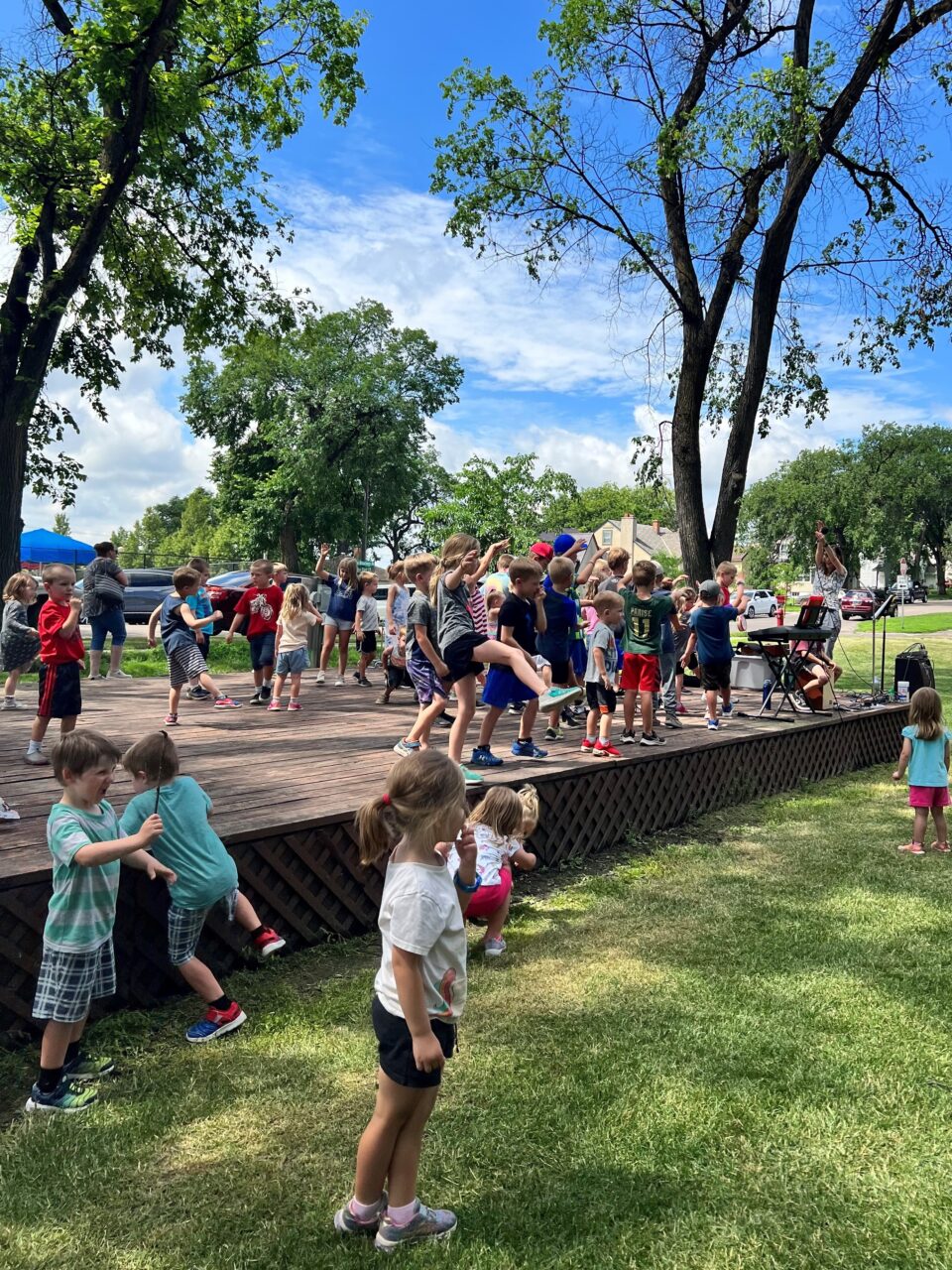 kids on stage at Custer Park during Kids Summer Stage event