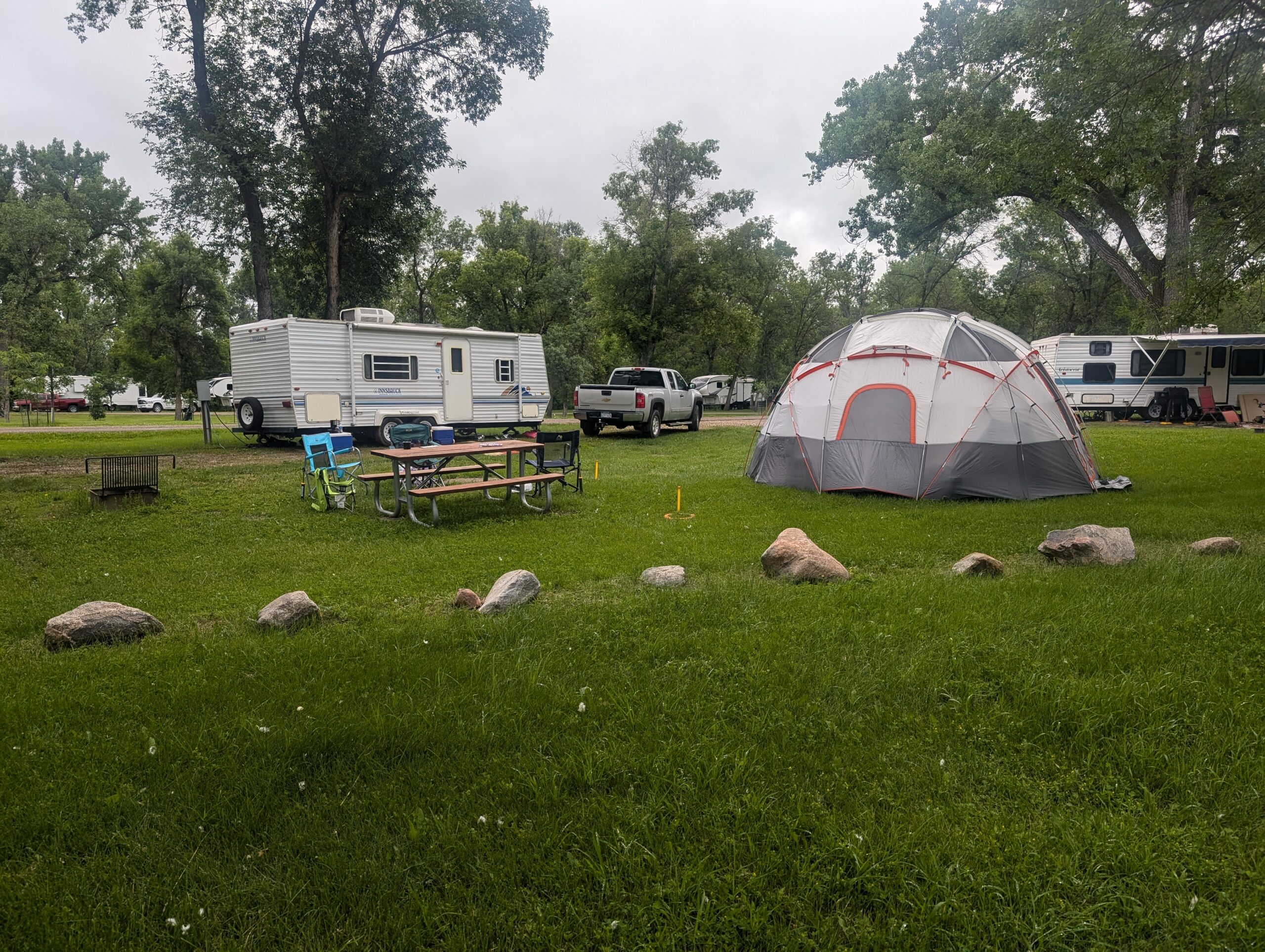 campsite at General Sibley with a tent, camper, and a picnic table