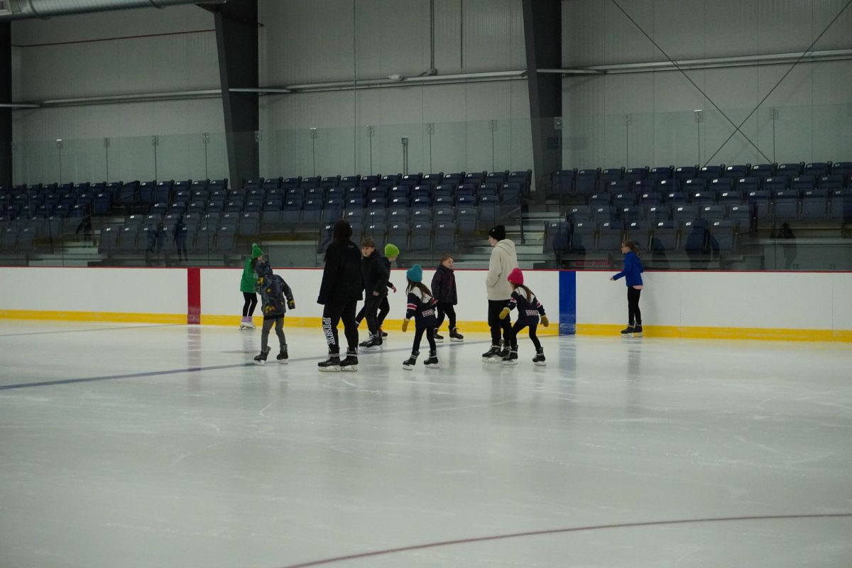 people ice skating at First International Bank & Trust Arena
