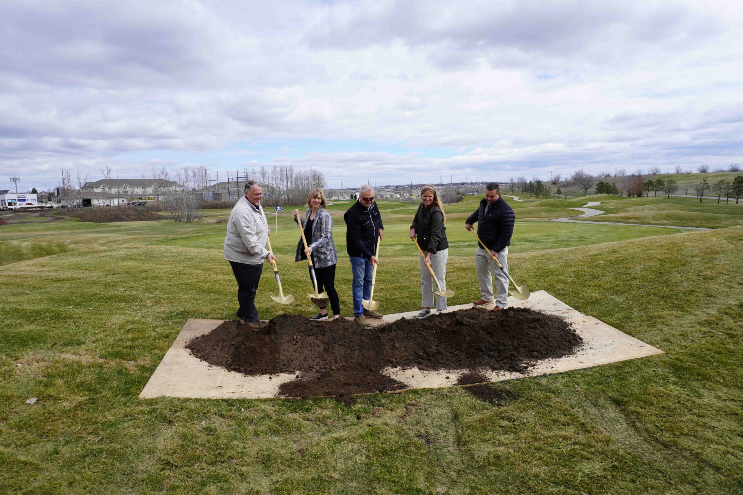 Photo of groundbreaking with shovels held by Park Board President Gilbertson, Park Board Commissioner Odell, DJGA President Tim Herman, Medora Sletten, and BPRD Executive Director Klipfel